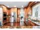 Beautifully designed kitchen featuring stainless steel appliances, granite countertops and hardwood flooring at 9556 Kemper Dr, Lone Tree, CO 80124