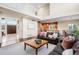 Open-concept layout with living area, kitchen, dining space, hardwood floors, and seamless flow for modern living at 9556 Kemper Dr, Lone Tree, CO 80124