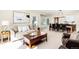 Inviting living area with ample natural light, cozy furniture, and seamless flow into the dining area at 9556 Kemper Dr, Lone Tree, CO 80124