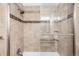 Close-up of the shower with glass door and tiled walls at 9556 Kemper Dr, Lone Tree, CO 80124