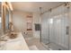 Modern bathroom boasting a glass-enclosed shower, stylish vanity, and contemporary fixtures for a spa-like experience at 16191 E Hinsdale Ln, Aurora, CO 80016