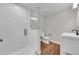 Basement bathroom with a walk-in shower and modern vanity at 14959 Wistera Way, Broomfield, CO 80023