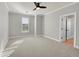 Spacious bedroom with carpet, ceiling fan and window with shutters at 14959 Wistera Way, Broomfield, CO 80023