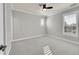 Simple bedroom with carpet, ceiling fan and window with shutters at 14959 Wistera Way, Broomfield, CO 80023