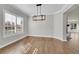 Light and airy dining room featuring hardwood floors and a modern chandelier at 14959 Wistera Way, Broomfield, CO 80023