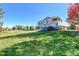 Two story house with a landscaped yard at 14959 Wistera Way, Broomfield, CO 80023