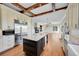 Gourmet kitchen with island and stainless steel appliances at 14959 Wistera Way, Broomfield, CO 80023