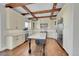 Spacious kitchen with granite countertops and wooden beams at 14959 Wistera Way, Broomfield, CO 80023