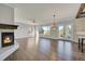 Spacious living room with fireplace and hardwood floors at 14959 Wistera Way, Broomfield, CO 80023