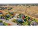 Aerial view of neighborhood with a house and landscaping at 14959 Wistera Way, Broomfield, CO 80023