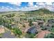 Aerial view of community with modern home, scenic lake, and mountain backdrop at 260 Upper Glenway Rd, Palmer Lake, CO 80133