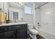 Well-lit bathroom featuring a shower-tub combo, a modern vanity, and stylish fixtures at 260 Upper Glenway Rd, Palmer Lake, CO 80133