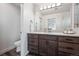 Modern bathroom with wood cabinets and a white countertop offering a clean and stylish space at 260 Upper Glenway Rd, Palmer Lake, CO 80133