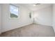Bright bedroom with plush carpet and views of trees and landscape, a peaceful retreat at 260 Upper Glenway Rd, Palmer Lake, CO 80133