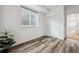 Cozy bedroom with sleek wood floors and a modern closet is bathed in natural light at 260 Upper Glenway Rd, Palmer Lake, CO 80133