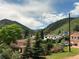 Picturesque exterior view of homes nestled in a valley with verdant trees and hills, showcasing a peaceful and scenic landscape at 260 Upper Glenway Rd, Palmer Lake, CO 80133