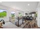 Open-concept kitchen with bar seating and a view into the living room at 260 Upper Glenway Rd, Palmer Lake, CO 80133