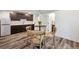 Kitchenette with stainless steel appliances, sleek countertops, wood cabinets, and table with four chairs at 260 Upper Glenway Rd, Palmer Lake, CO 80133