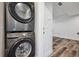 The laundry room features a newer, front loading, stacked washer and dryer at 260 Upper Glenway Rd, Palmer Lake, CO 80133