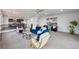 Bright, open living area with stylish furnishings and access to the kitchen at 260 Upper Glenway Rd, Palmer Lake, CO 80133