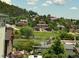 Scenic neighborhood view with lush greenery and charming homes nestled in a hillside setting, creating a tranquil ambiance at 260 Upper Glenway Rd, Palmer Lake, CO 80133