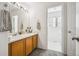 Bathroom featuring a double sink vanity and a toilet in a separate room at 126 Foxglove Dr, Brighton, CO 80601