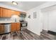 Well-equipped kitchen with stainless steel appliances, modern backsplash, and ample countertop space, functional and stylish at 4509 Everett St, Wheat Ridge, CO 80033