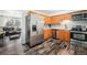 Modern kitchen featuring stainless steel appliances, light wood cabinets, and sleek countertops, ideal for cooking at 4509 Everett St, Wheat Ridge, CO 80033