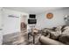 Spacious living room featuring wood-look floors, open layout, and natural light, perfect for relaxation and entertainment at 4509 Everett St, Wheat Ridge, CO 80033