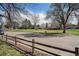 View of neighborhood park with mature trees and a playground on a sunny day at 4509 Everett St, Wheat Ridge, CO 80033