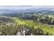 Beautiful aerial view of the property backing to HOA open space and trail at 2023 Mammoth Ct, Evergreen, CO 80439