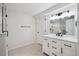 Beautiful bathroom featuring a modern vanity with sleek fixtures and a glass-enclosed shower at 2023 Mammoth Ct, Evergreen, CO 80439