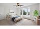 Bright bedroom with a large bay window and views of the natural landscape at 2023 Mammoth Ct, Evergreen, CO 80439