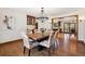 Elegant dining area with unique chairs and beautiful lighting fixture at 2023 Mammoth Ct, Evergreen, CO 80439