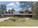 Charming home with a sprawling front porch and beautiful landscaping at 2023 Mammoth Ct, Evergreen, CO 80439