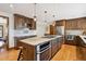 Well-equipped kitchen with a center island, stainless steel appliances, and plenty of cabinet space at 2023 Mammoth Ct, Evergreen, CO 80439