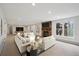 Spacious living room with a fireplace, large windows, and comfortable seating at 2023 Mammoth Ct, Evergreen, CO 80439