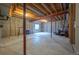Unfinished basement featuring concrete floors and exposed wood beams at 475 Hampstead Ave, Castle Rock, CO 80104