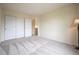 Neutral bedroom featuring a closet with doors and a light-colored carpet at 475 Hampstead Ave, Castle Rock, CO 80104