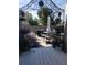 Charming deck with metal frame canopy, outdoor seating, and lush potted plants for a serene outdoor retreat at 475 Hampstead Ave, Castle Rock, CO 80104