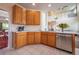 Bright kitchen with stainless steel appliances, ample counter space, tile flooring, and a view into the adjacent living area at 475 Hampstead Ave, Castle Rock, CO 80104