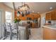 A well-equipped kitchen features stainless steel appliances, custom cabinetry, and a functional center island with bar stool seating at 475 Hampstead Ave, Castle Rock, CO 80104
