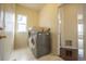 Well-lit laundry room equipped with modern washer and dryer units at 475 Hampstead Ave, Castle Rock, CO 80104