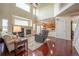 Spacious living room features hardwood floors, fireplace and an open design connecting to the kitchen at 475 Hampstead Ave, Castle Rock, CO 80104