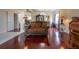 Spacious living room featuring hardwood floors, stylish furniture, and an open layout leading into the dining area at 475 Hampstead Ave, Castle Rock, CO 80104
