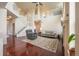 Open living room featuring hardwood floors, a fireplace, and a staircase leading to the second floor at 475 Hampstead Ave, Castle Rock, CO 80104