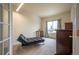 Bright office with a futon couch, large window and neutral colored walls at 475 Hampstead Ave, Castle Rock, CO 80104