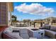Comfortable backyard deck with outdoor seating area and fire pit with views at 336 Painted Horse Way, Erie, CO 80516