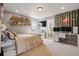 Well-lit bedroom with fun decor, adjacent computer area, and stylish design at 336 Painted Horse Way, Erie, CO 80516
