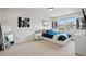 Modern bedroom featuring a large window, neutral carpet, and ample natural light at 336 Painted Horse Way, Erie, CO 80516